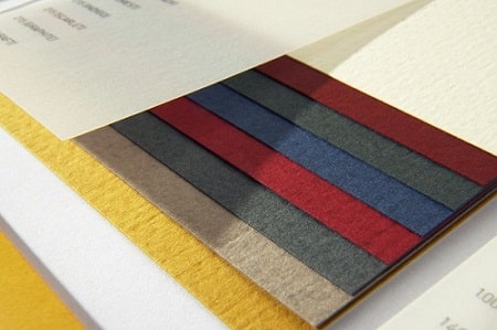 Designer preparing artwork for custom printing on different materials
