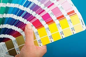 Designer preparing custom branding artwork for printed packaging and promotional products
