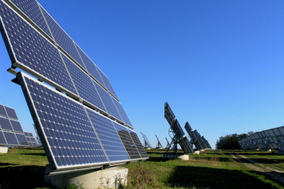 Aerial view of residential neighborhood with solar panels on rooftops